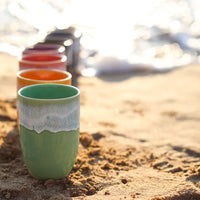 A colourful handmade stoneware drinks beaker from Glosters